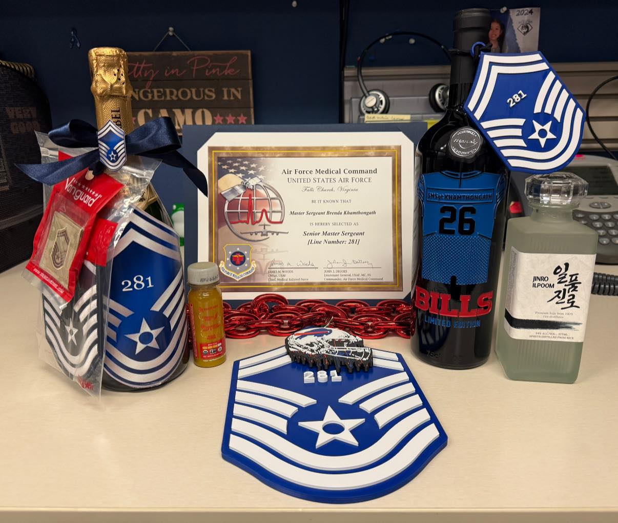 Promotion gift display: chevron plaque, Bills wine, champagne.